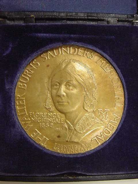 a plaque with an image of a woman in the center