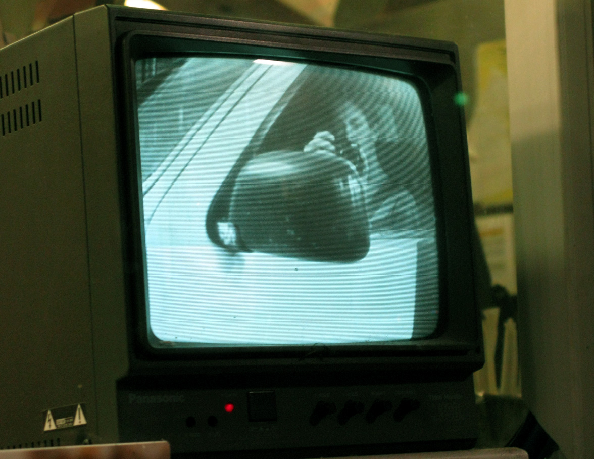an old tv with a person on the screen