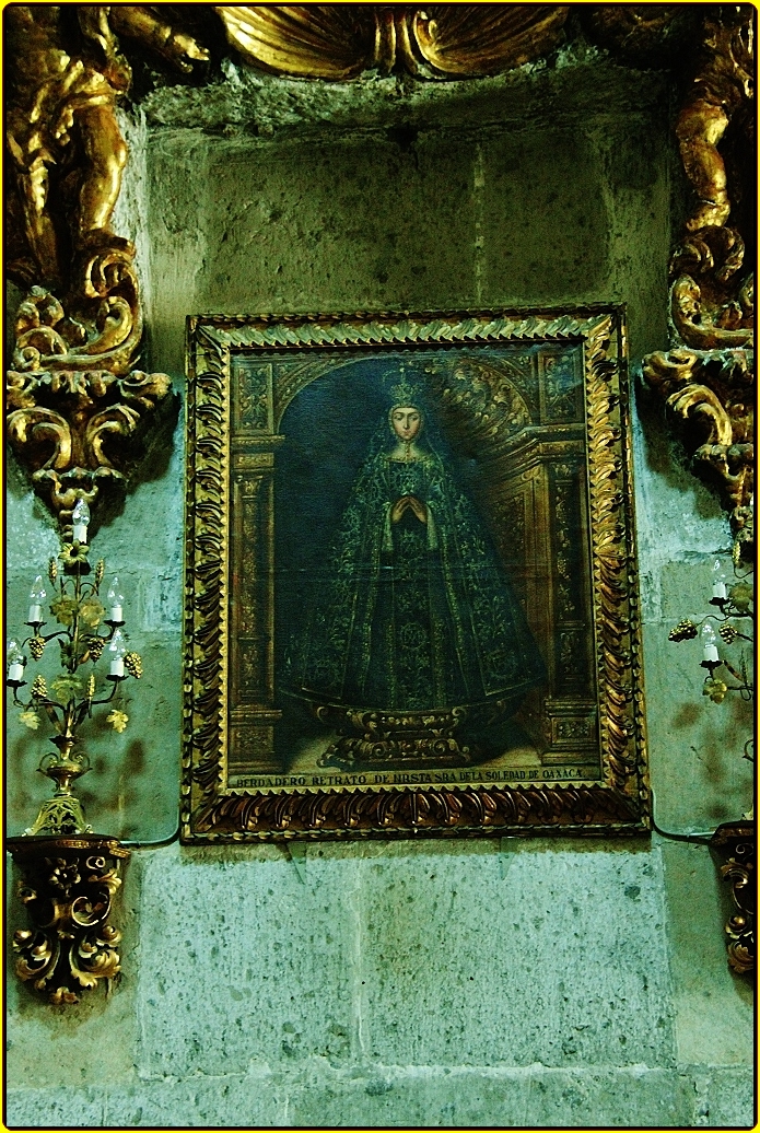 ornate gold decoration with antique painting in a museum