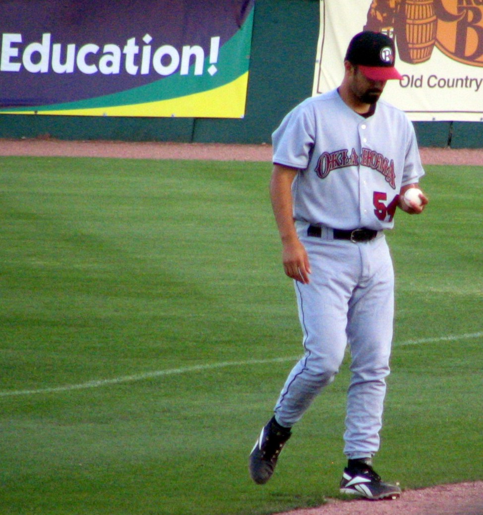 a baseball player prepares to throw the ball during a baseball game