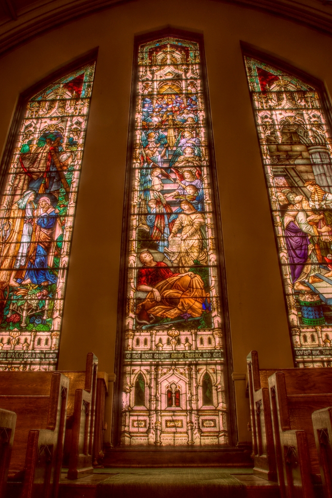 a couple of stained glass windows inside of a church