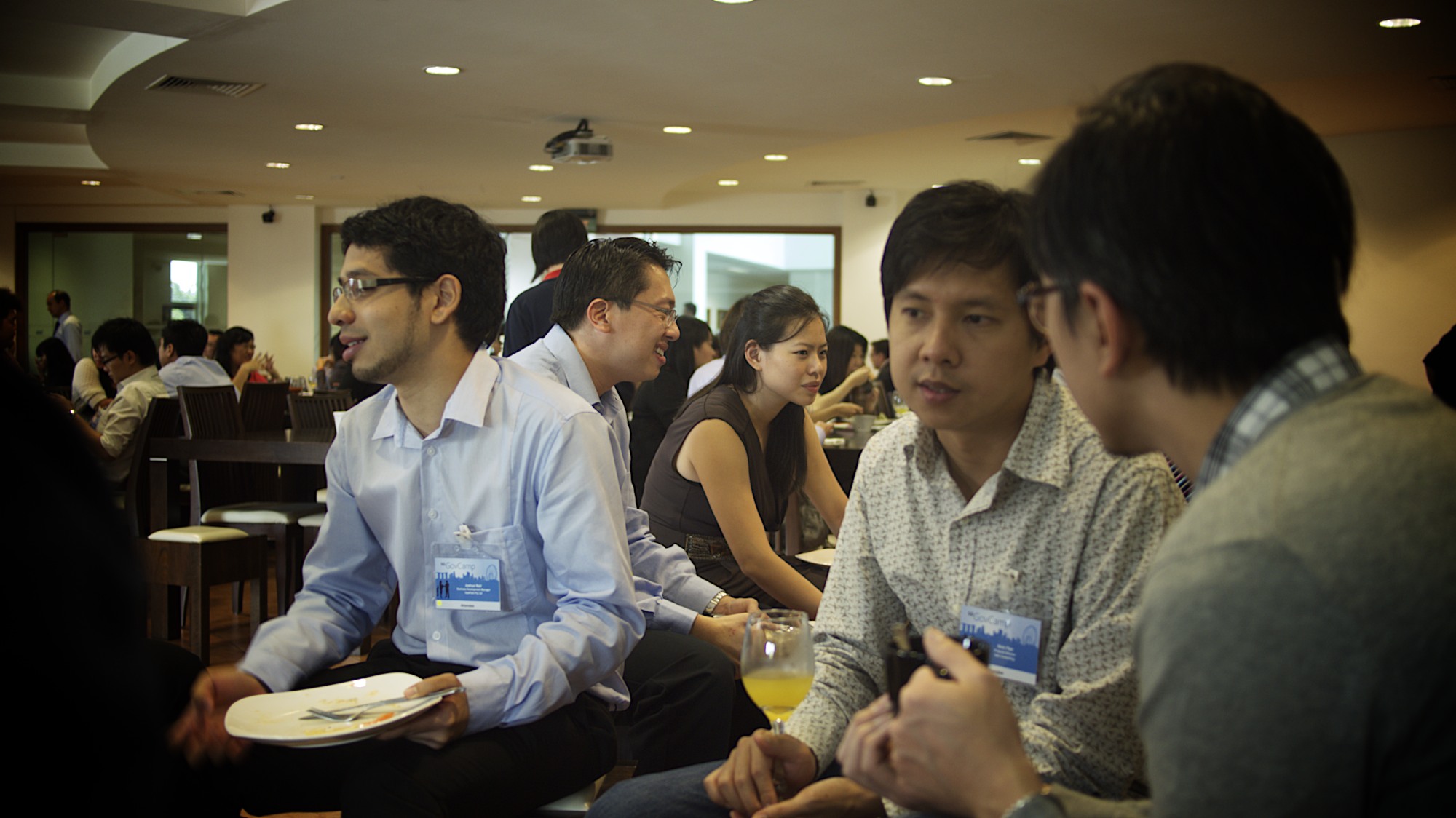 a group of people sit next to each other in chairs