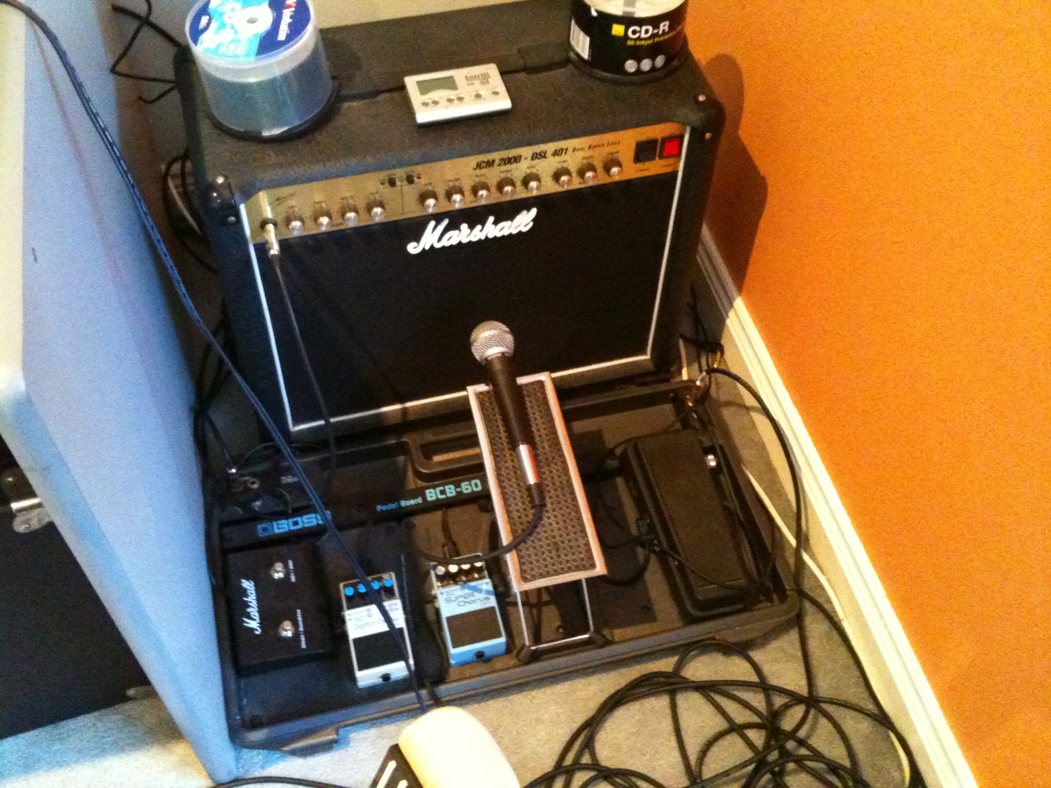 some electronics a microphone and headphones on a counter