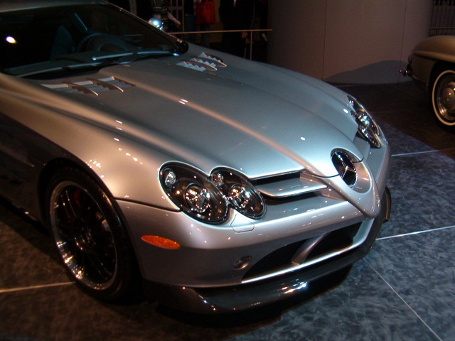 a shiny silver mercedes benz sports car
