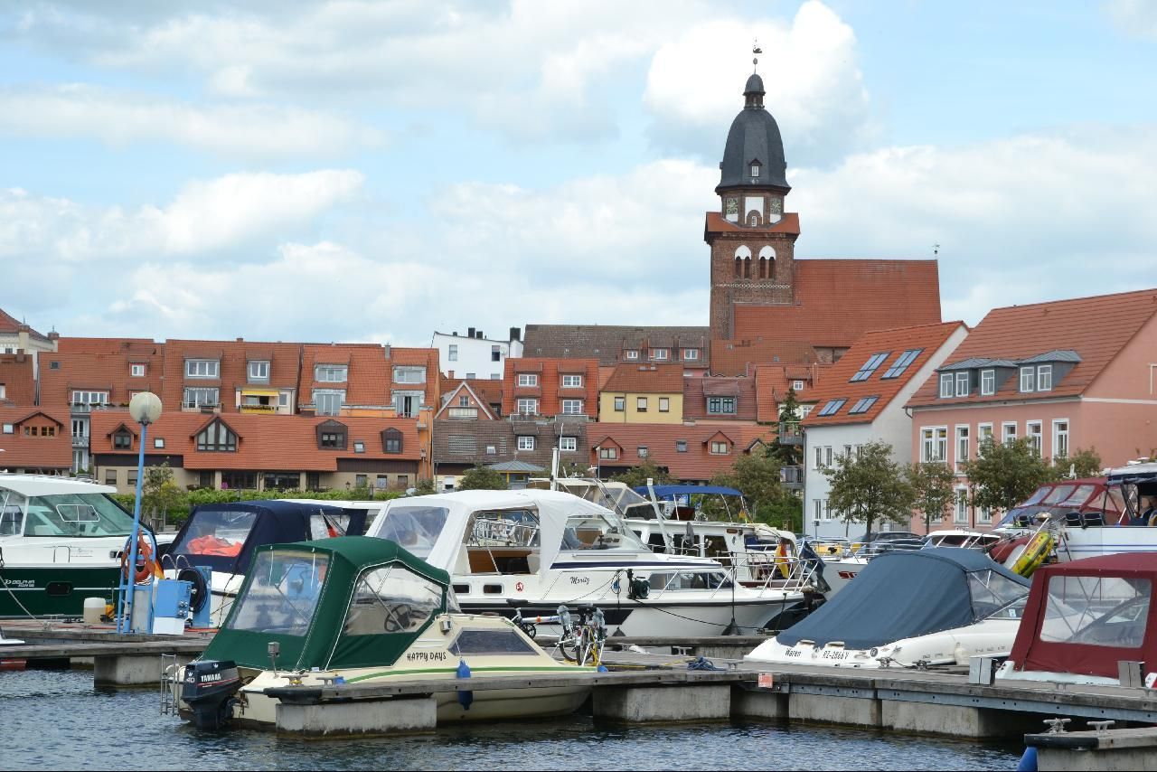 there are many small boats docked in the water