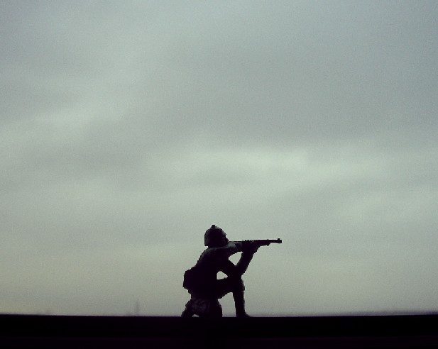 a man is standing in front of the cloudy sky