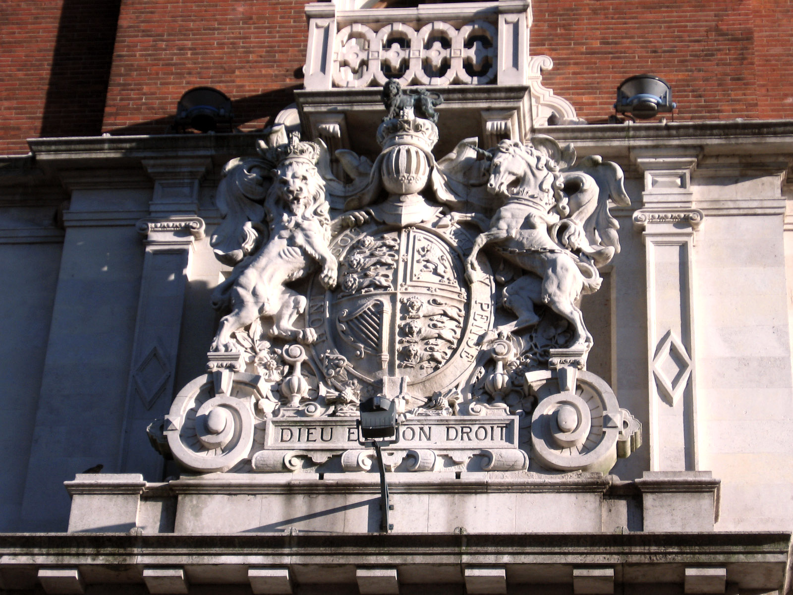 an ornate coat of arms on a building