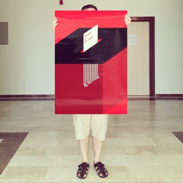 a person holding up a large red piece