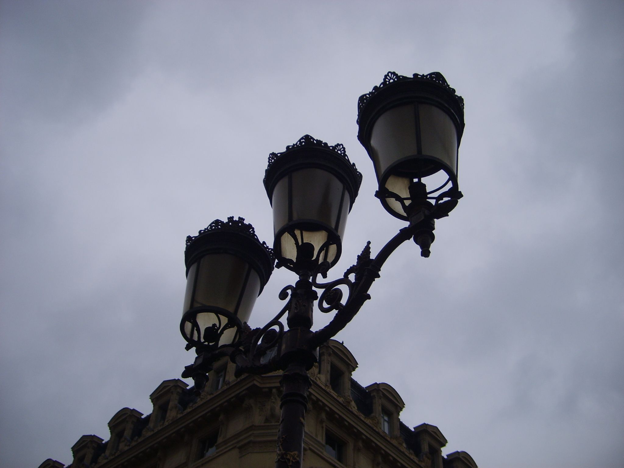 street lights with cloudy sky in the background