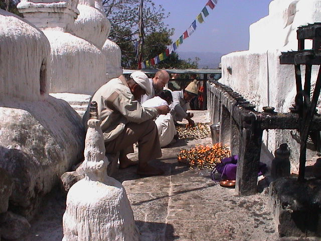 a man crouching next to an altar at a church