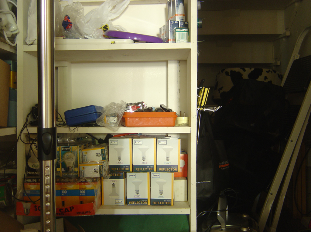 shelves filled with supplies, tools, and other items