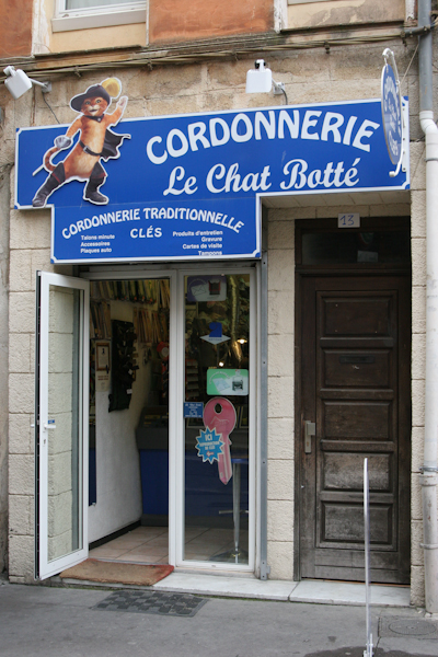 the store front of a french butchers and pastry shop