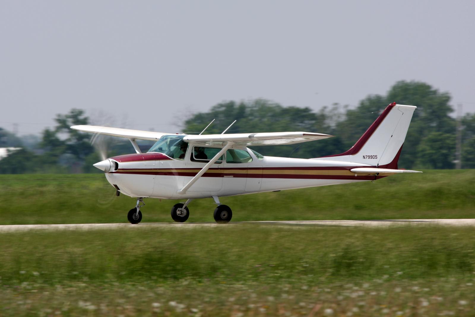 a small airplane taking off from the runway