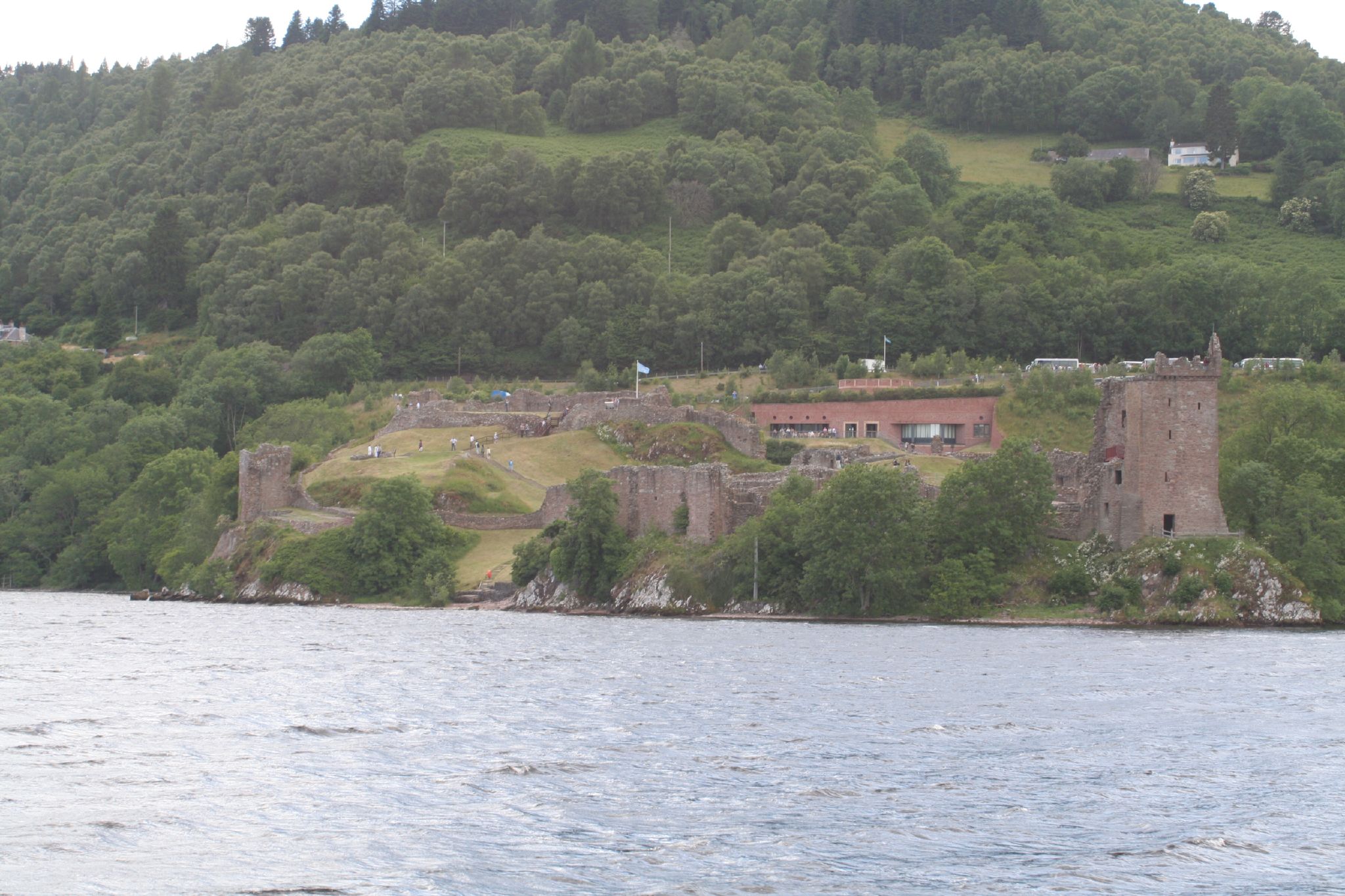 an old castle next to a body of water