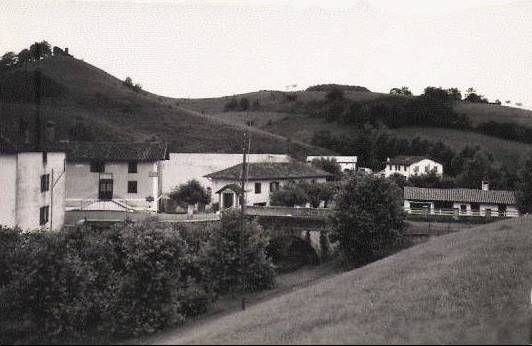 this po is black and white of houses near the hills