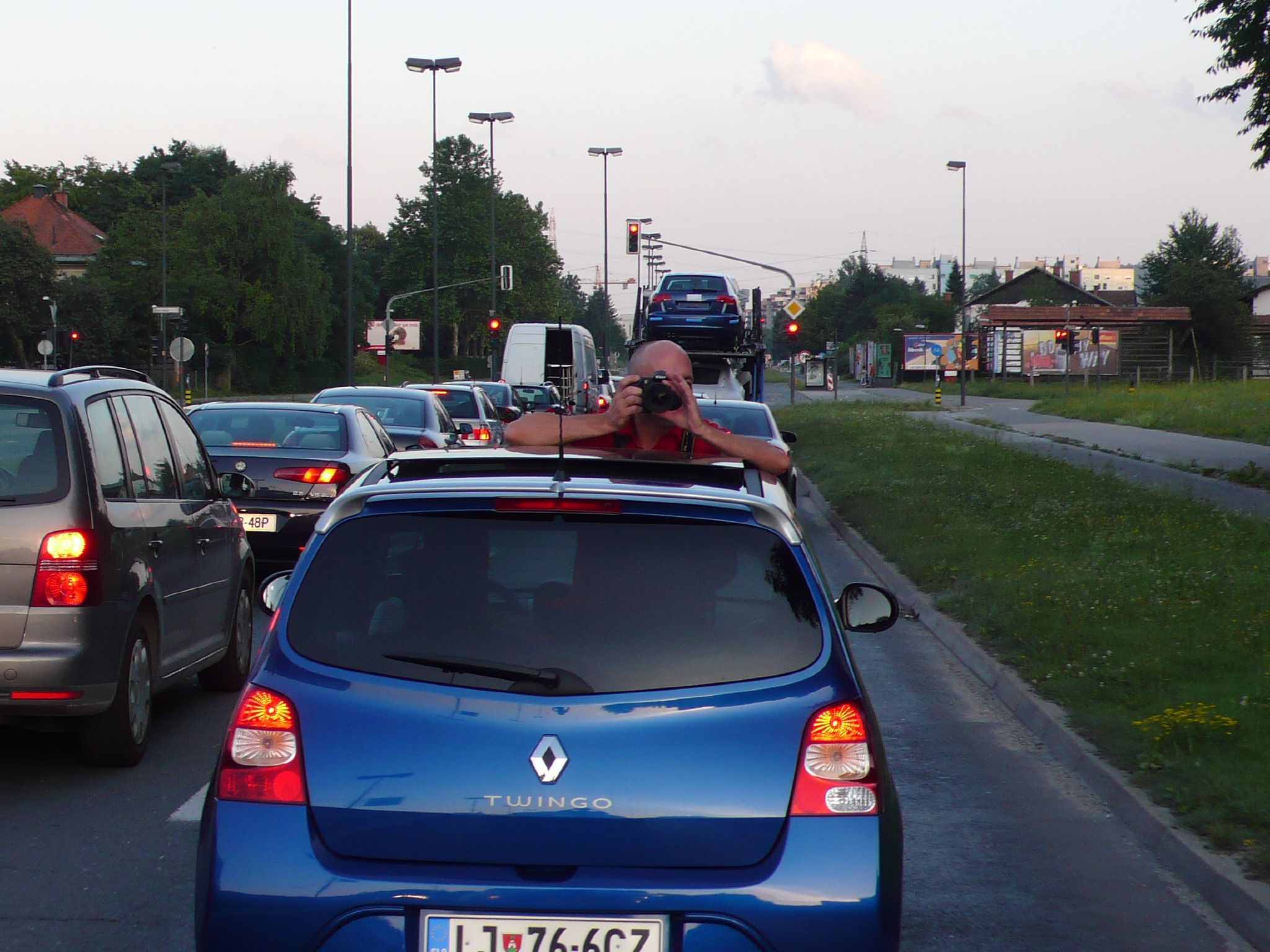 a man laying on the roof of a car