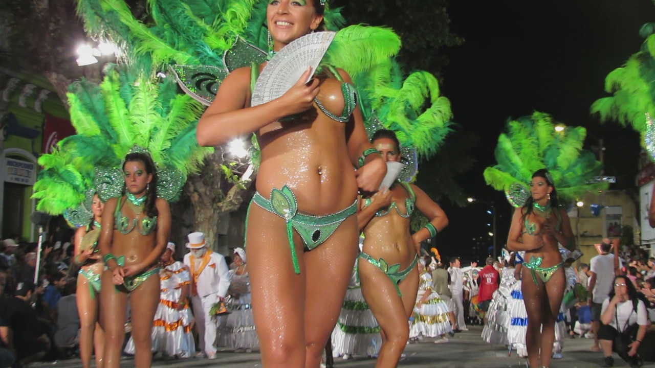 beautiful women are dressed up in green and white costumes