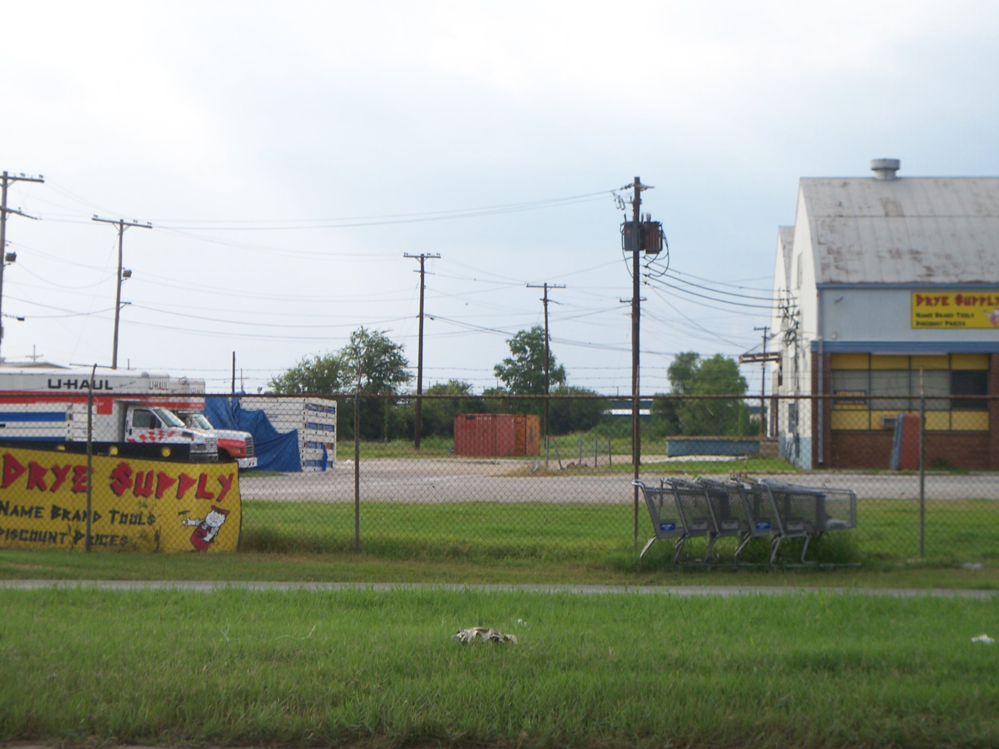 the sign says burrito next to some abandoned buildings