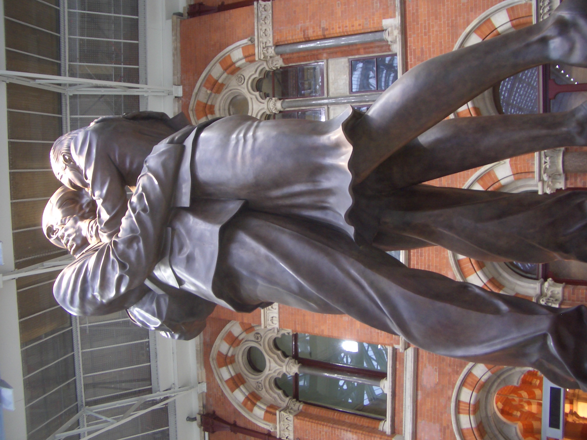 a statue of a man is in front of a doorway