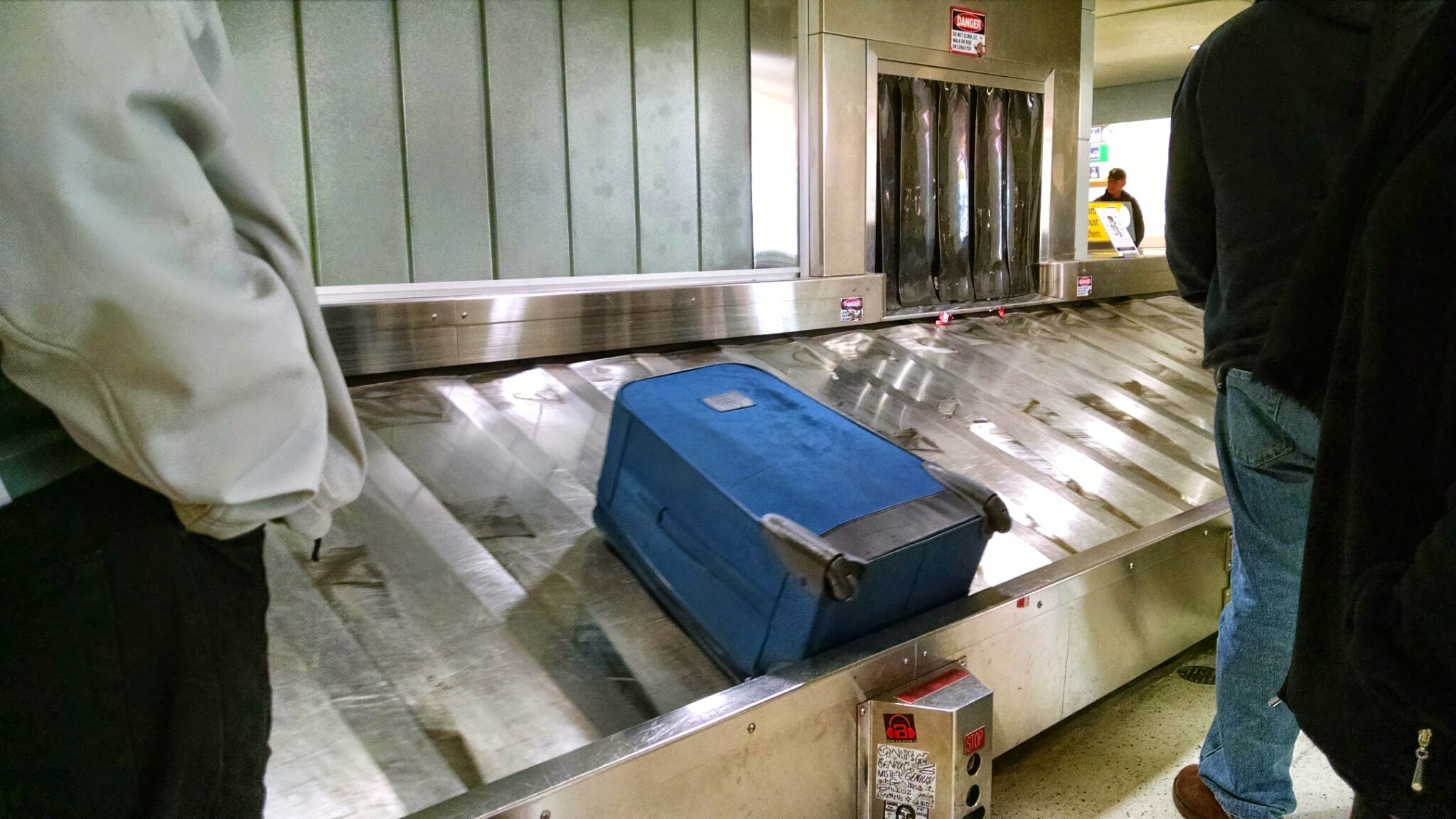 a suitcase on the conveyor belt at an airport