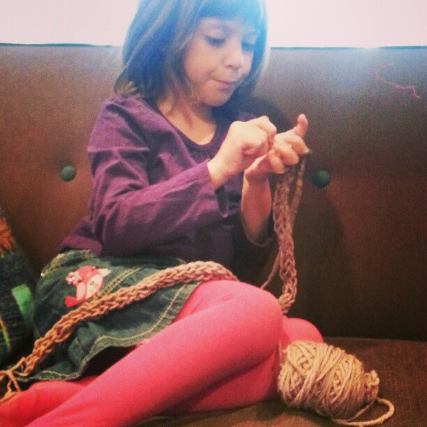 a  is knitting soing with yarn