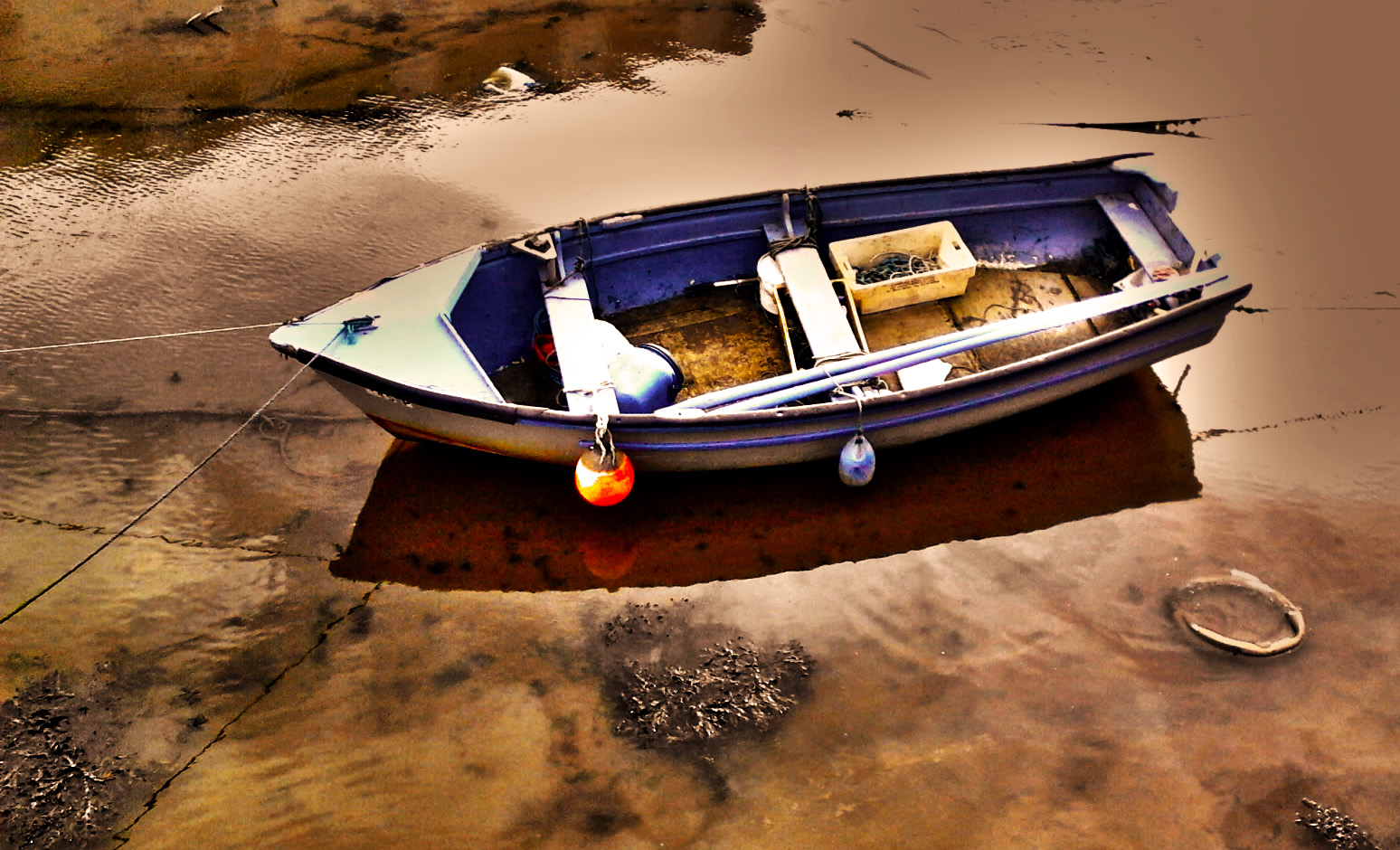 a boat that is floating on some water