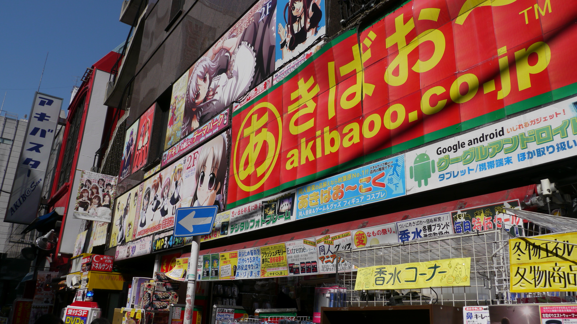 many advertits and other signs are attached to buildings