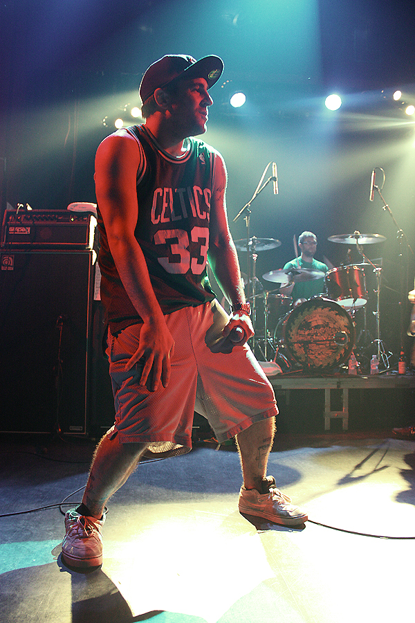 a man in front of microphones playing drums