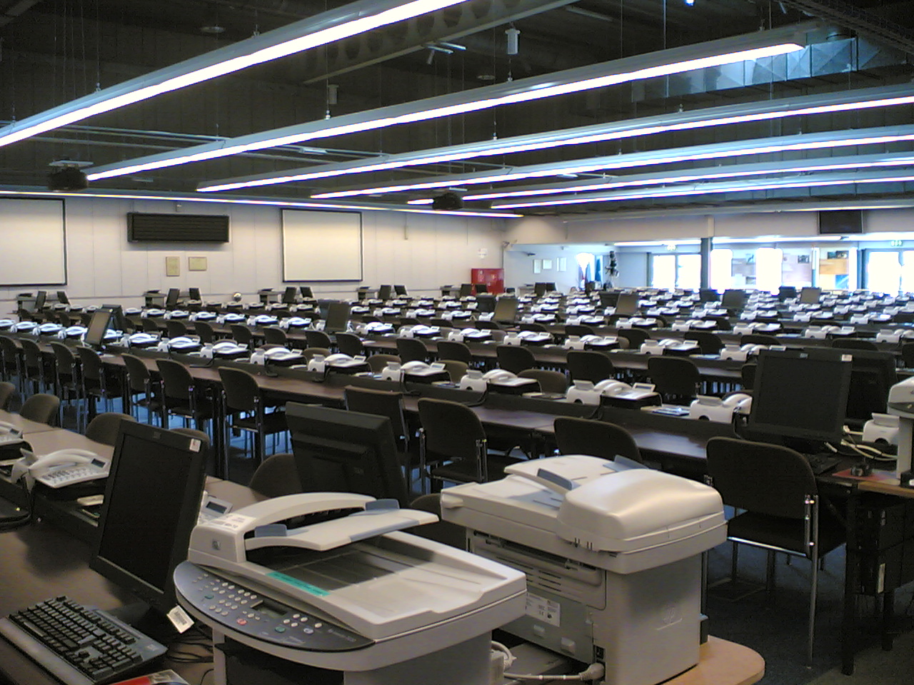 a room filled with computer equipment and laptops