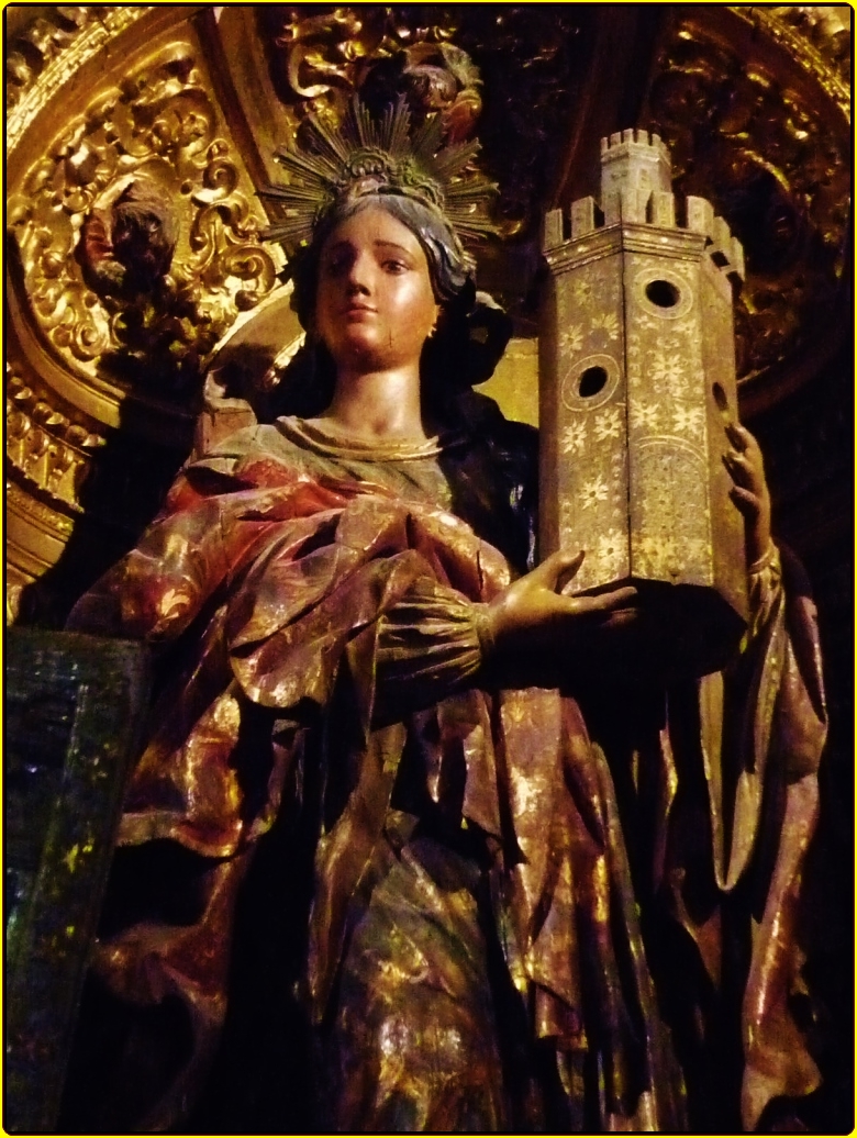 a statue of a woman holding soing in her hands