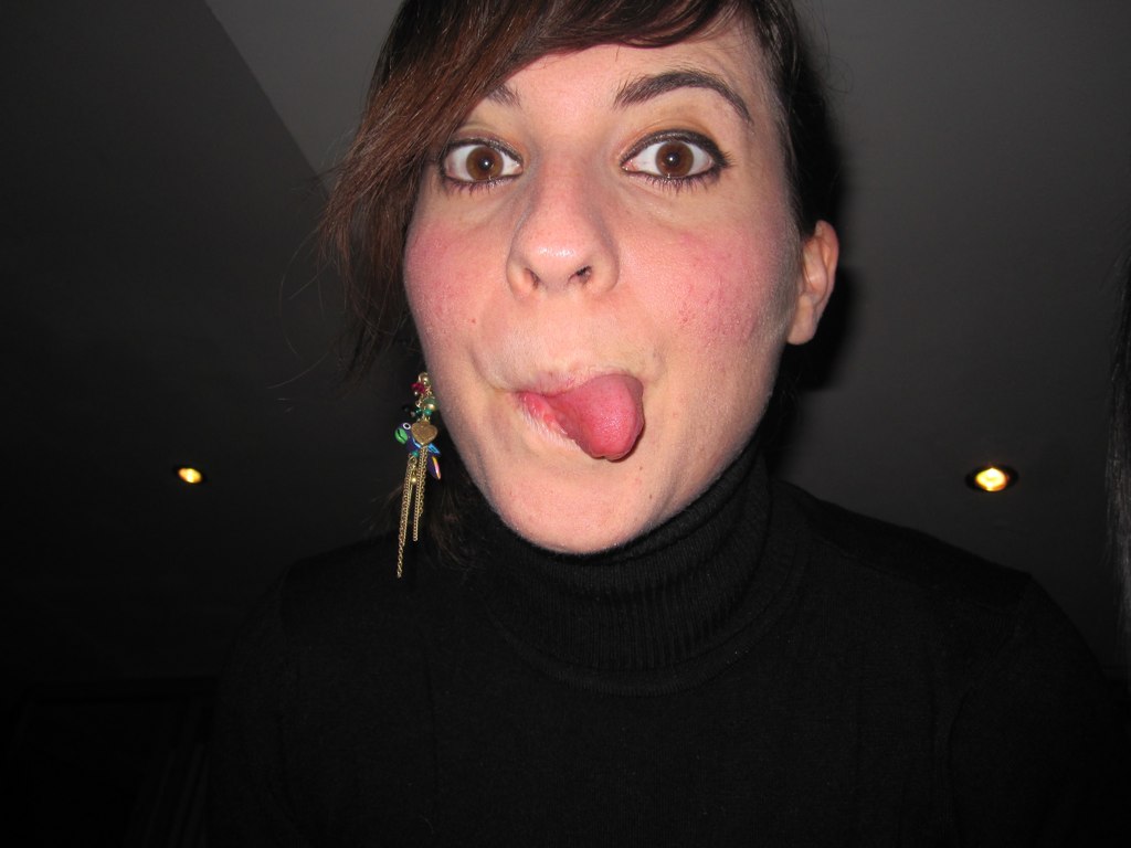 a woman making a funny face with her tongue out