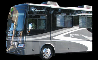 a motor home is shown parked outside of a building