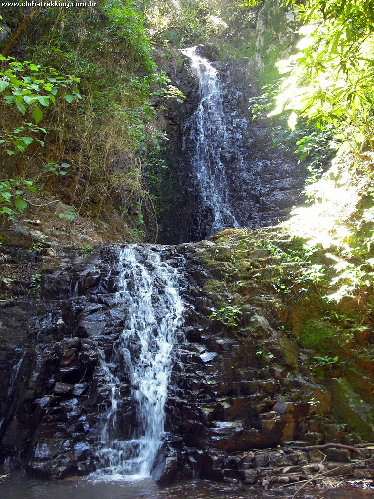 waterfall with small waterfall and vegetation on the side