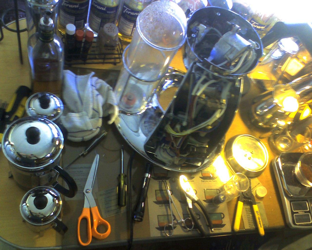 a collection of kitchen accessories sitting on a table