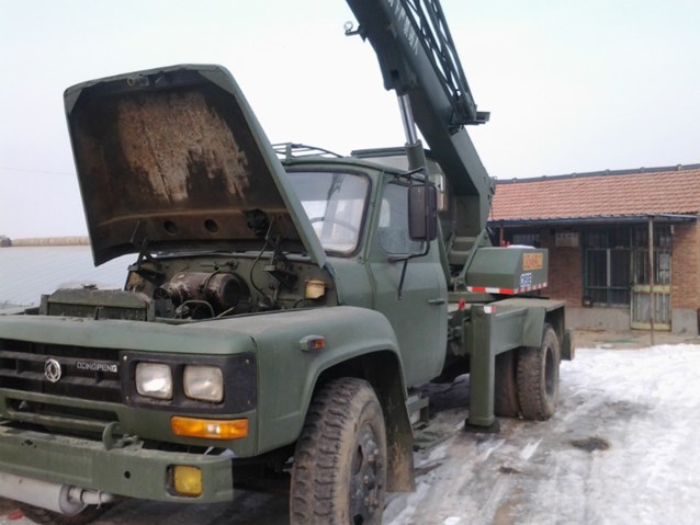 an army truck is parked outside in the snow