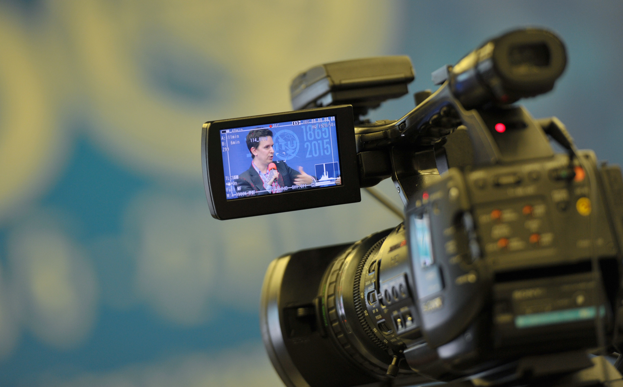 a video camera recording a speech