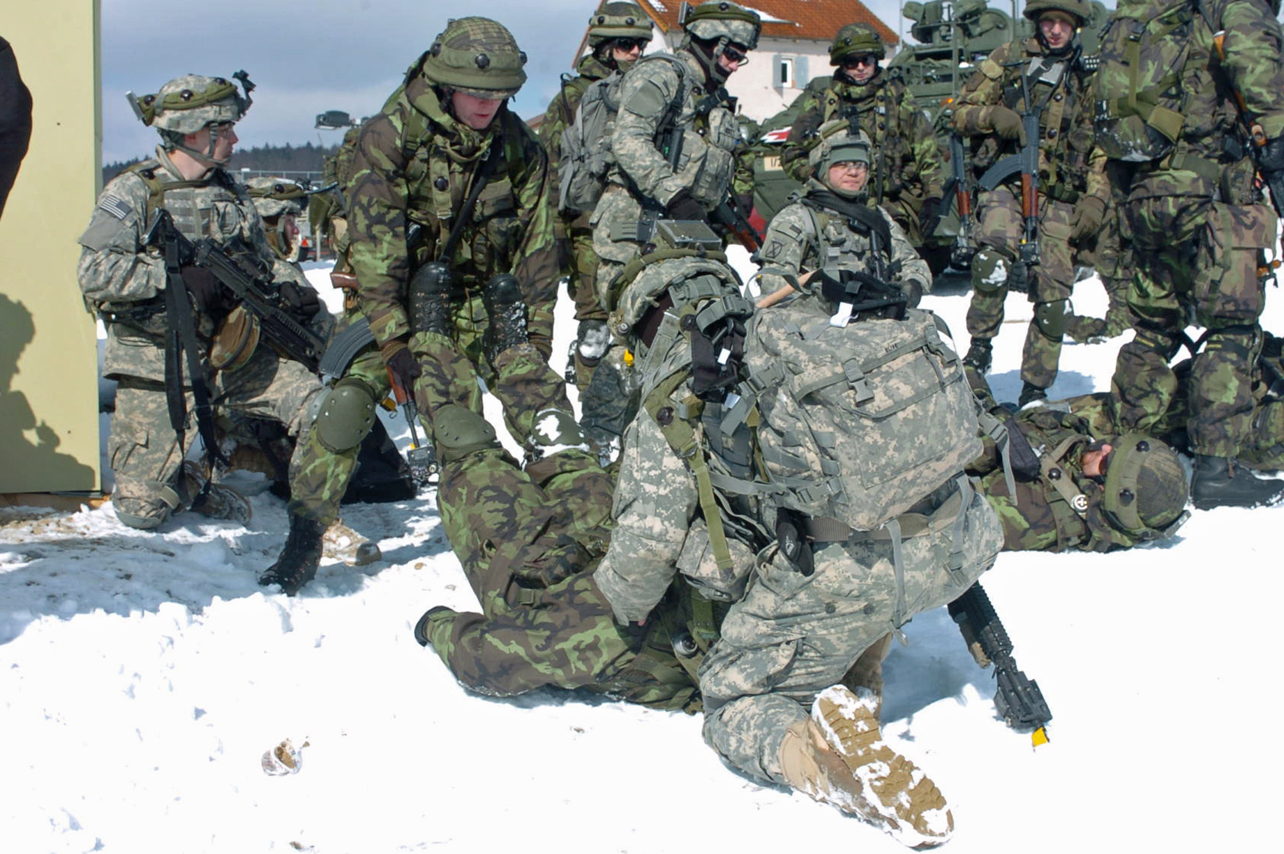 there are soldiers that are kneeling in the snow
