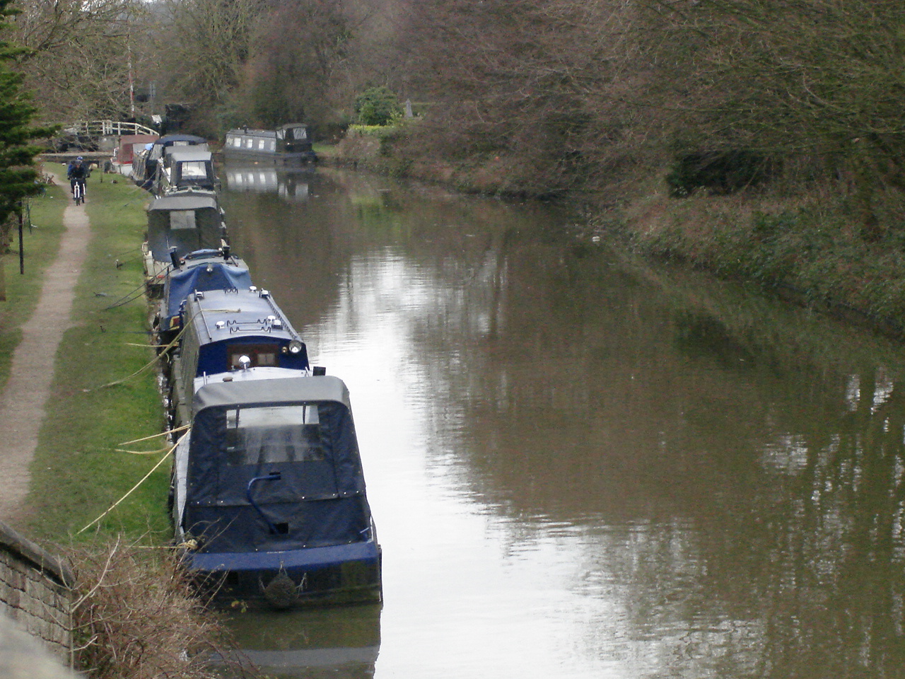 a canal with several boats passing on it