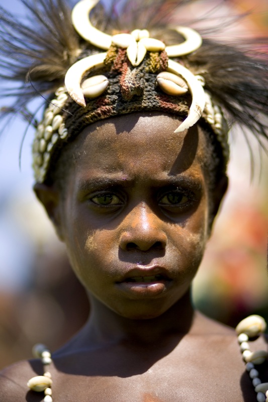 a person in traditional clothing with an elaborate headdress