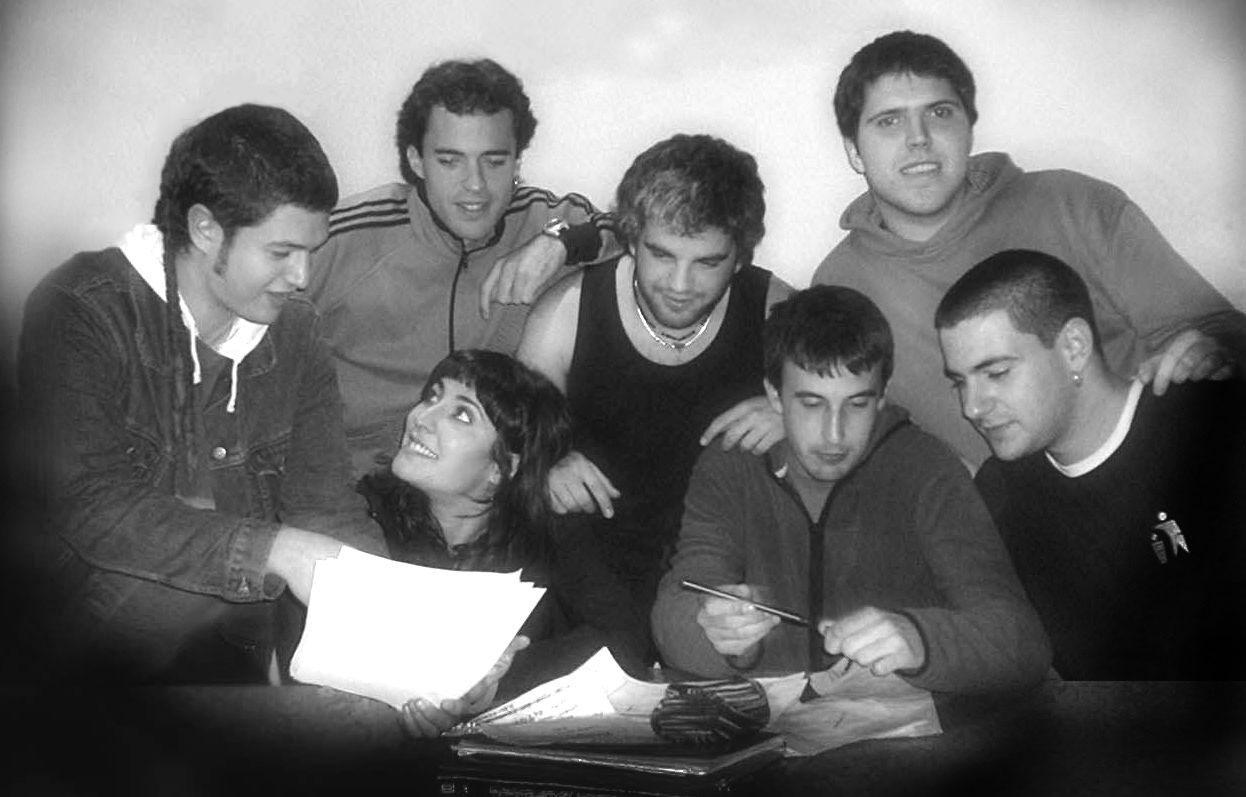 a group of people in black and white poses together