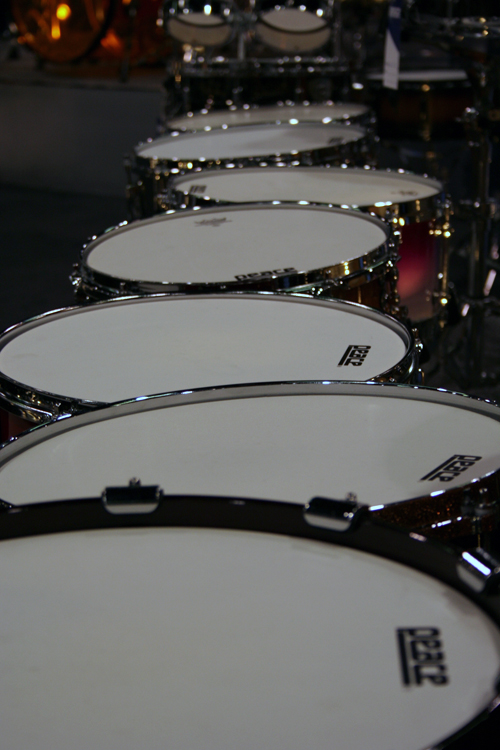 many drum heads lined up next to each other