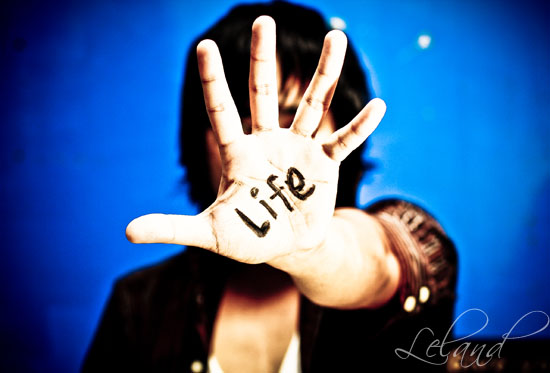 a woman with the words life written on her hands