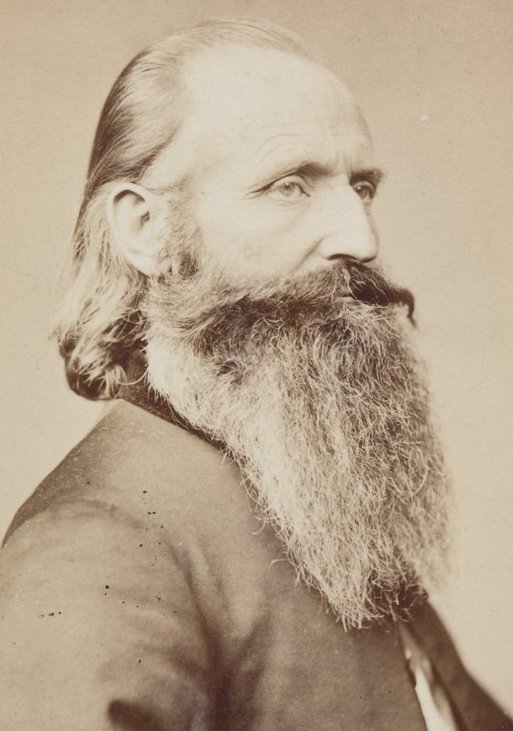 an old fashioned pograph of a man with a long beard