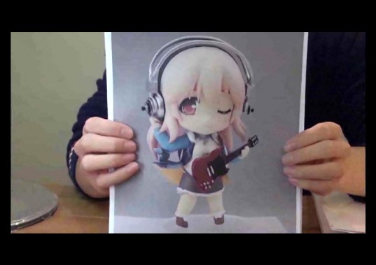 a person holding up an image of an animal wearing headphones