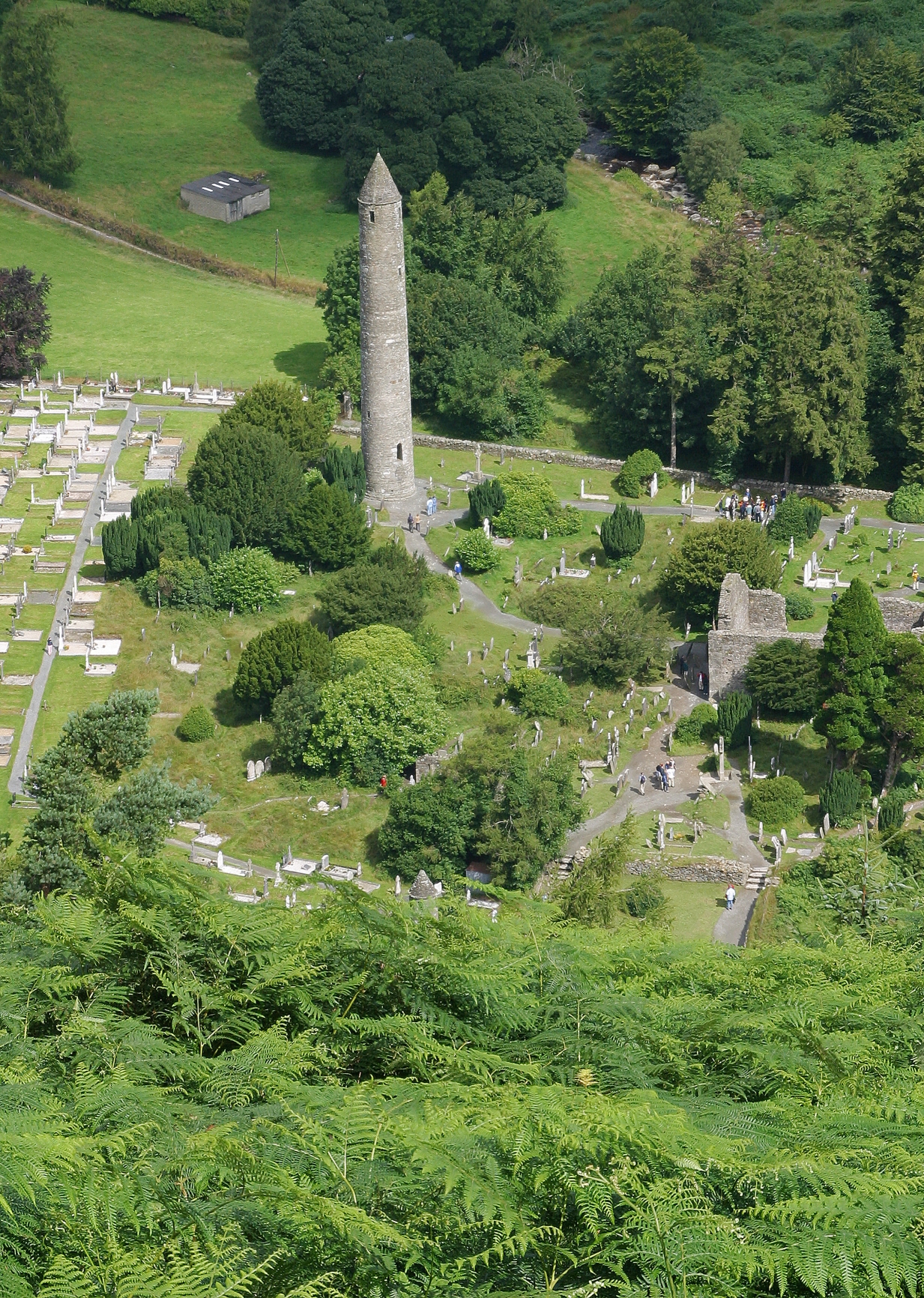 a cemetery with a tower in the middle