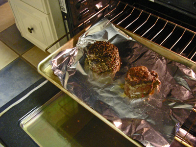two pastries on a sheet of foil in an oven