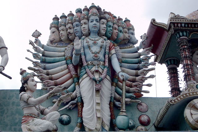 statues of hindu deities stand near each other