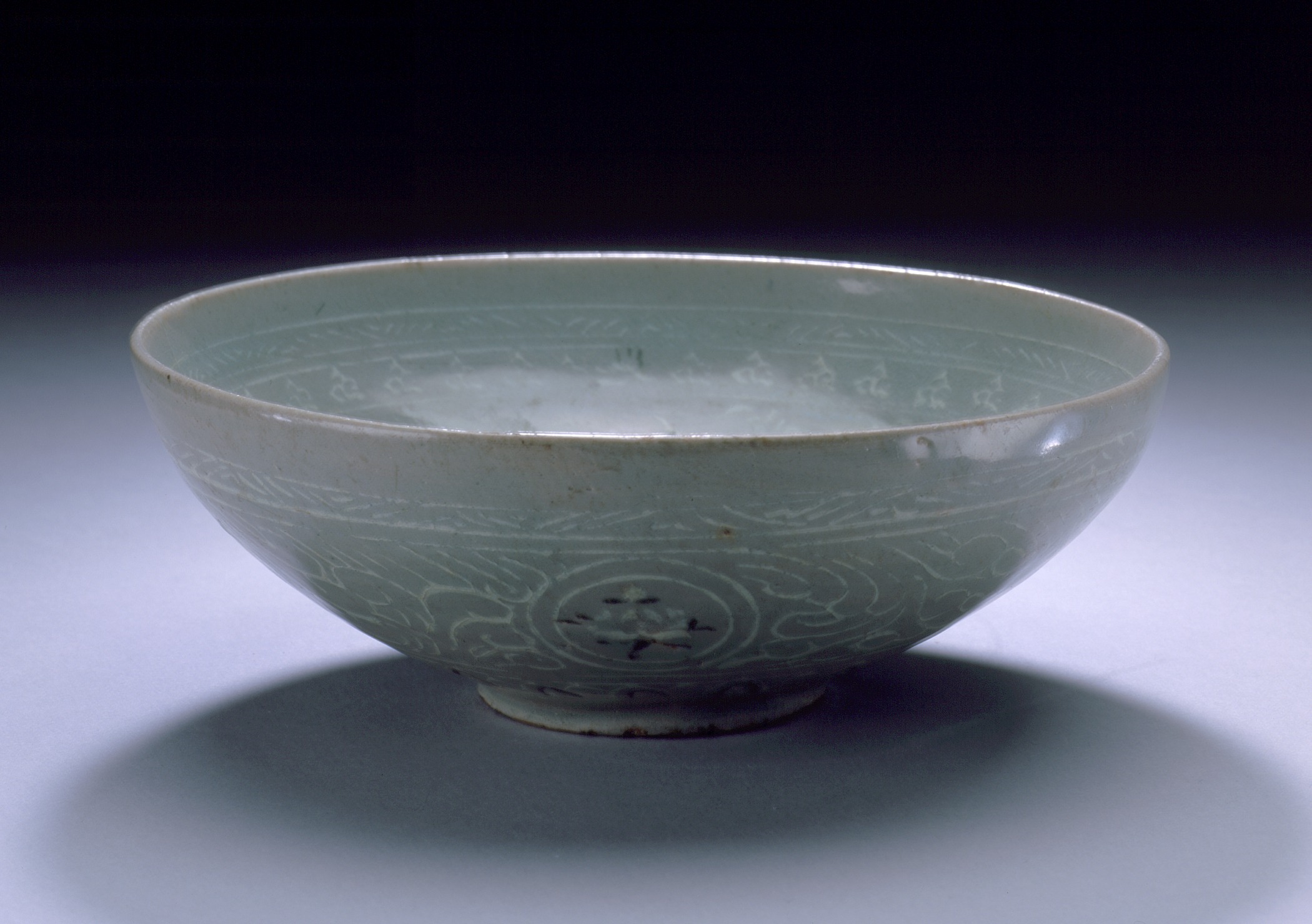 a bowl with white frosted decoration on it