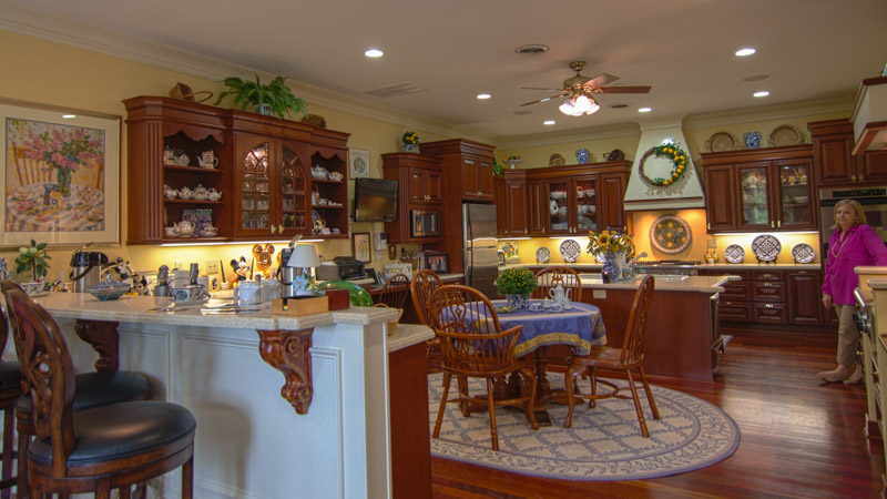 an empty kitchen and dining room are in a home