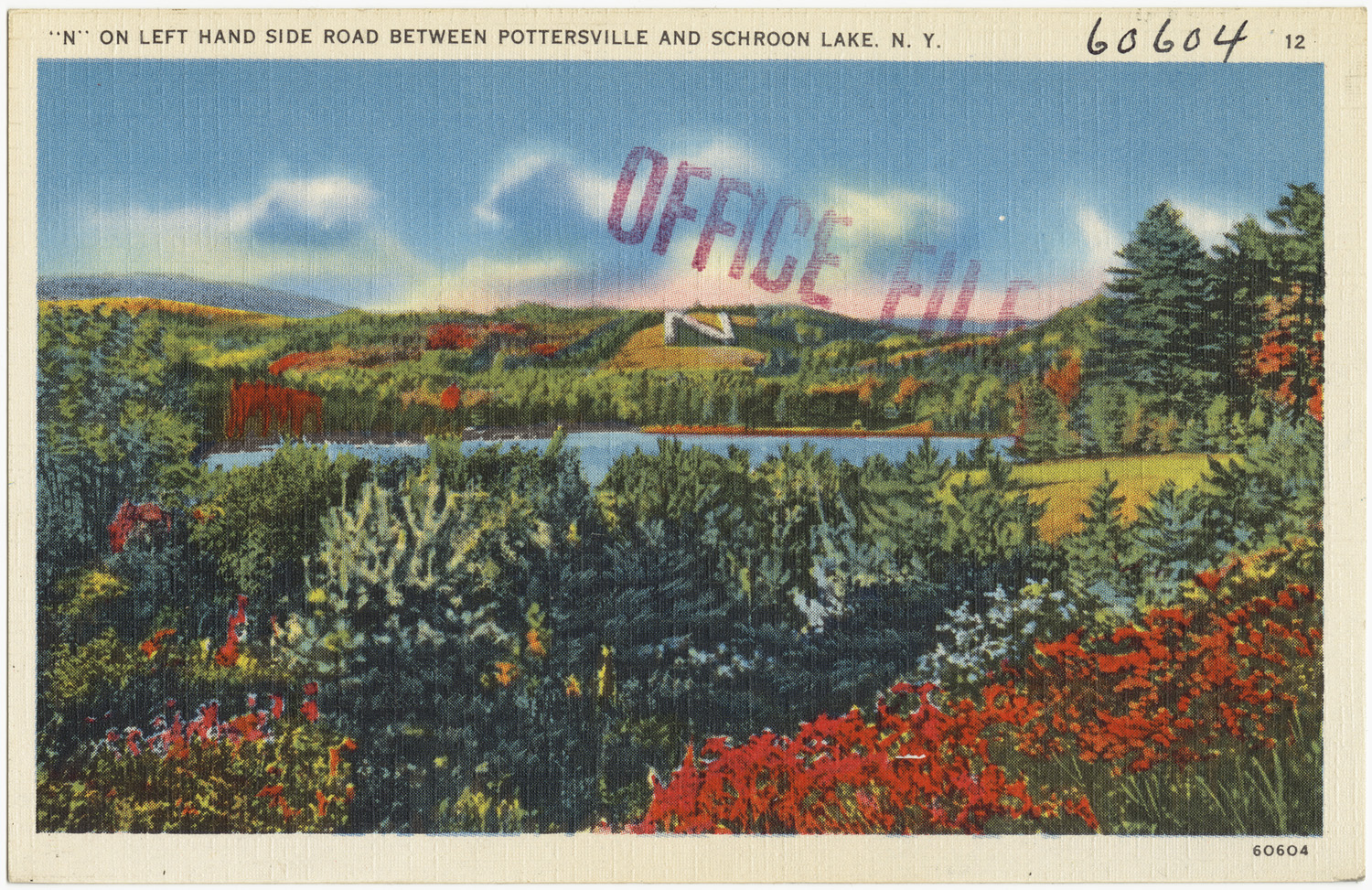 an old postcard with a lake in the middle